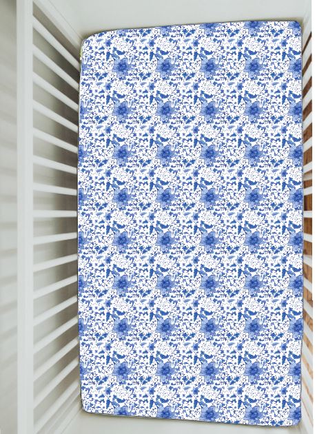 Soft cotton crib sheet with delicate chinoiserie design, perfect for a gender-neutral nursery