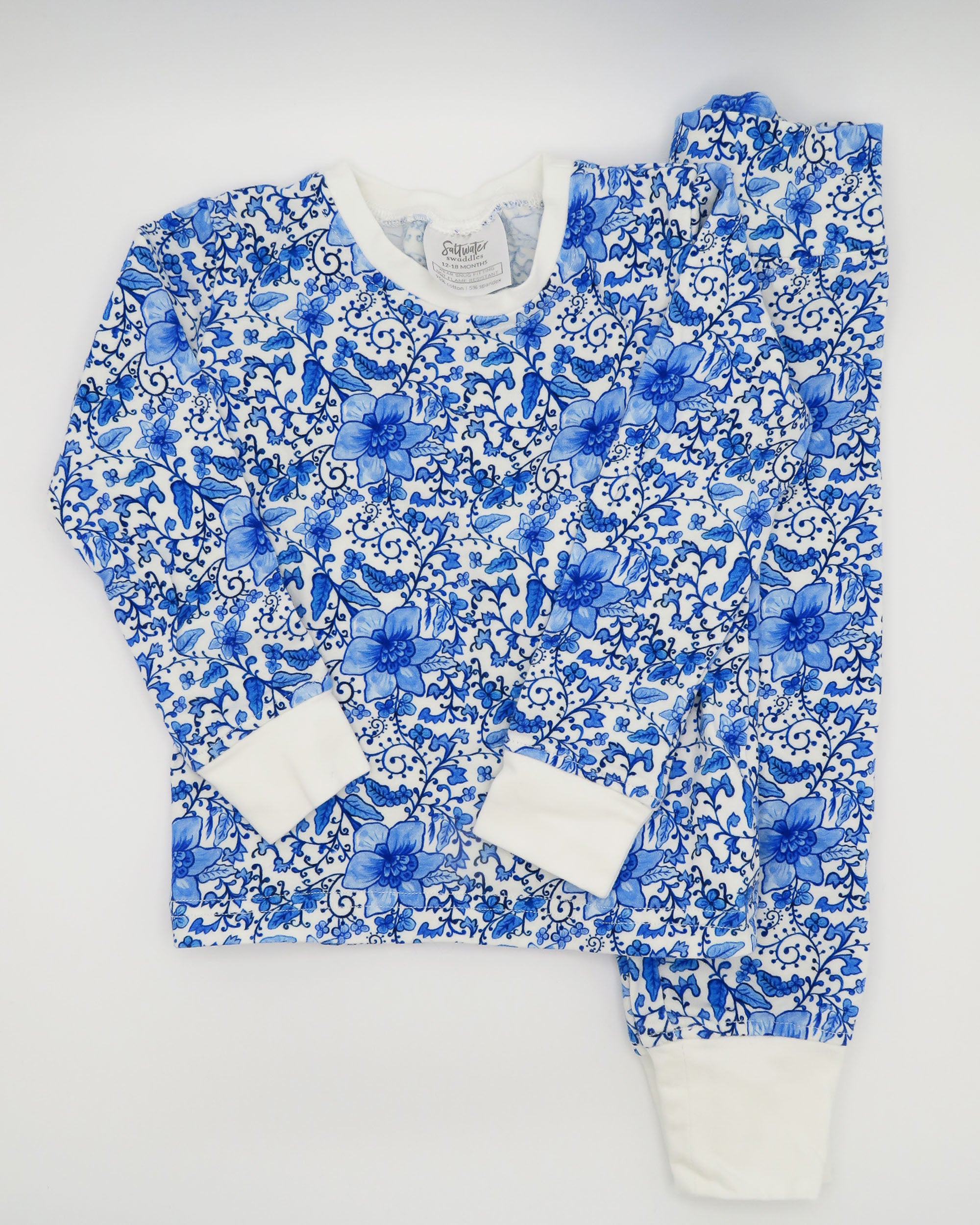 Charming Chinoiserie pajamas in soft white cotton, suitable for indoor or outdoor wear, displayed on a white background.