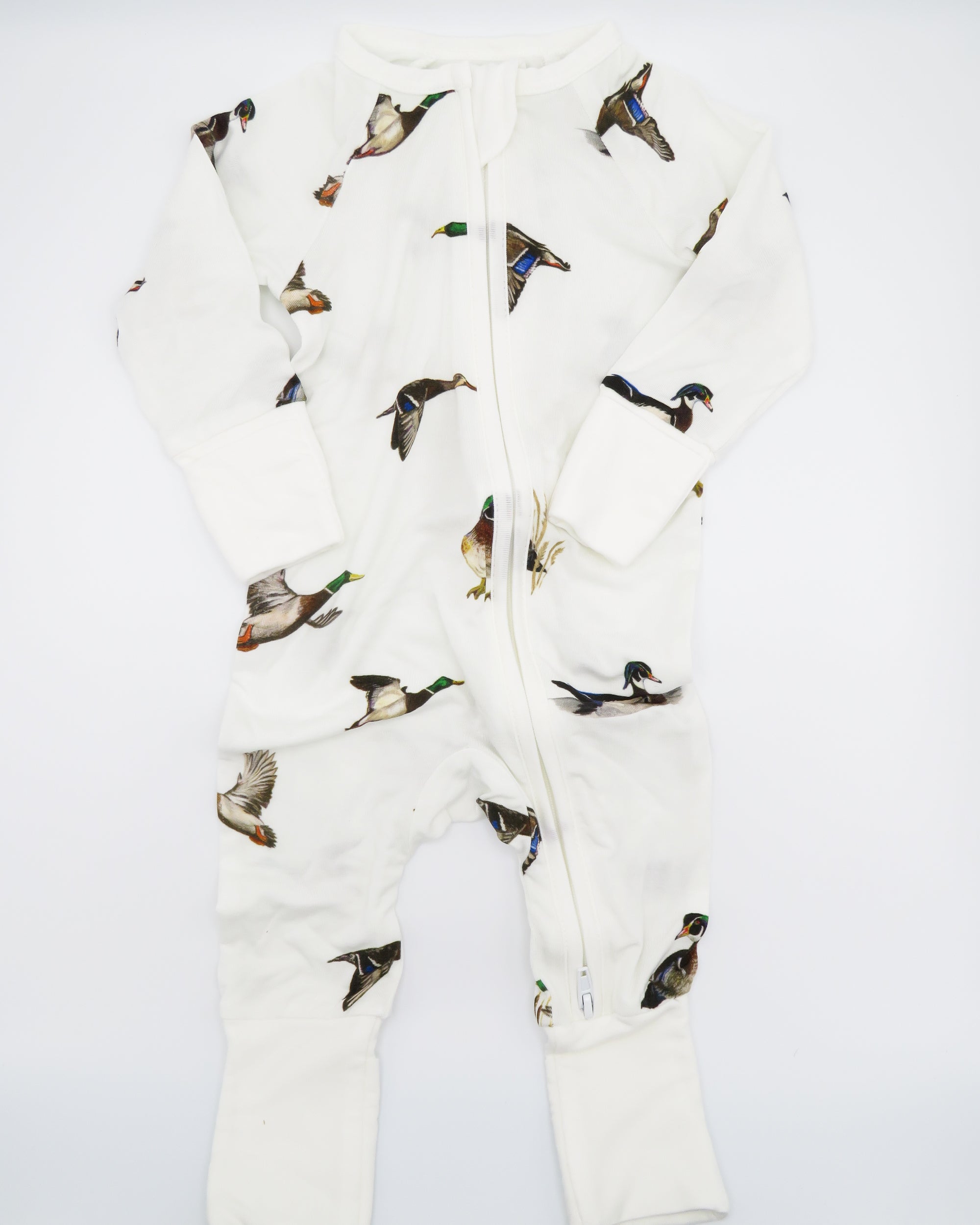 Diving Ducks convertible zip footies designed for easy dressing and comfort for infants. Printed on soft white fabric.