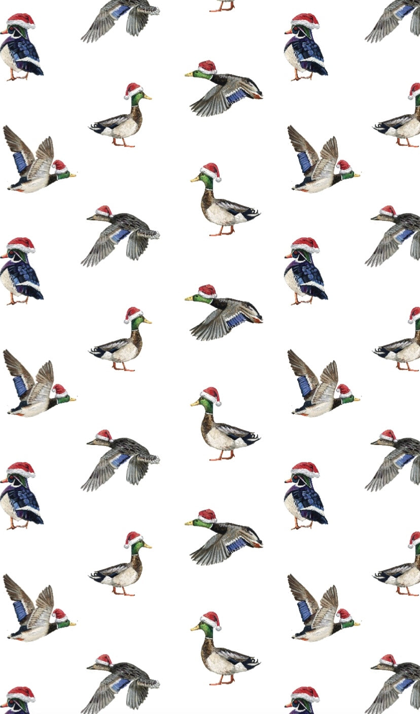 A cute newborn outfit featuring a print of ducks with Santa hat.