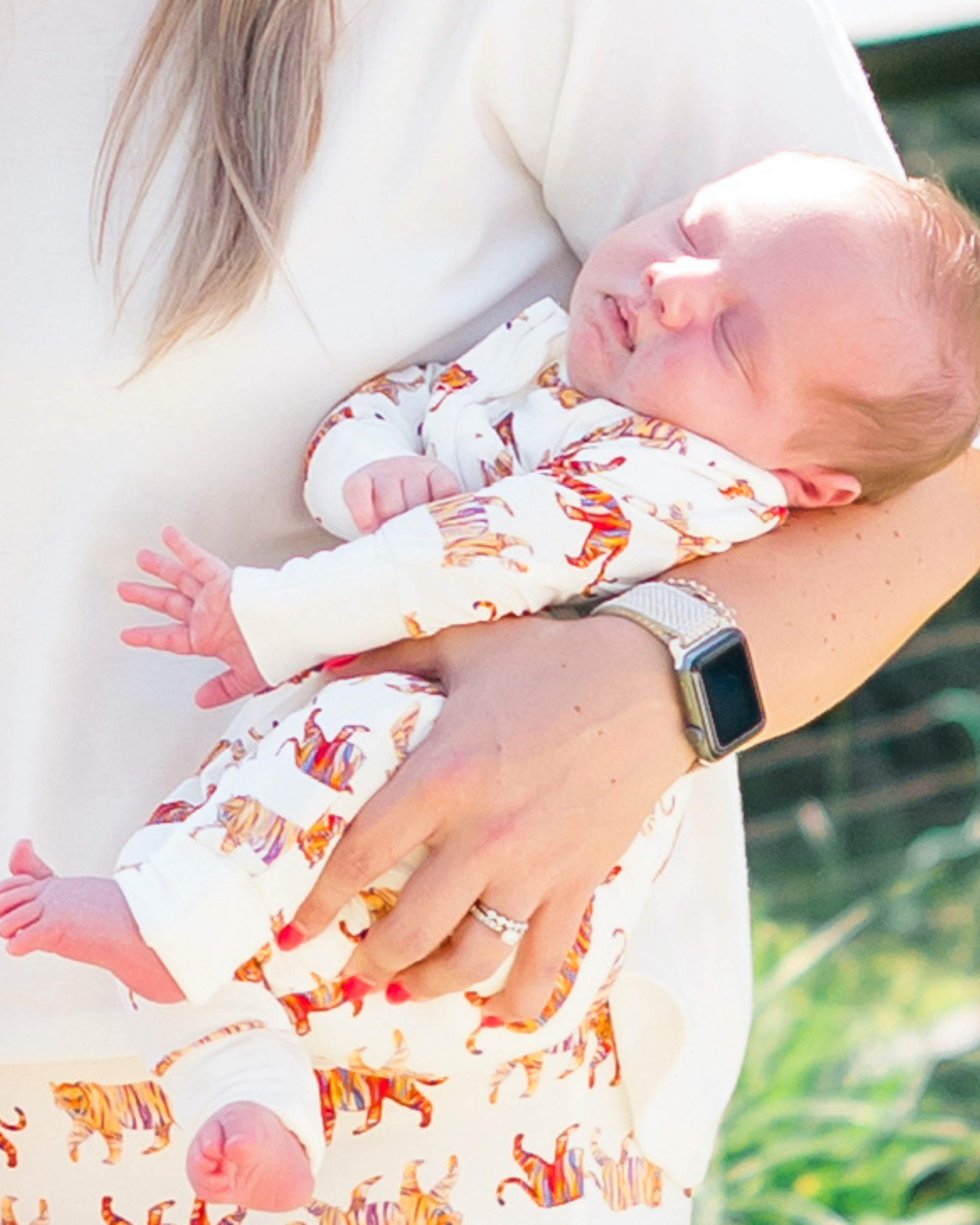 Easy Tiger Convertible Zip Footie for kids, featuring a playful tiger pattern printed on soft white bamboo fabric. Perfect for both indoor and outdoor use for your little ones.