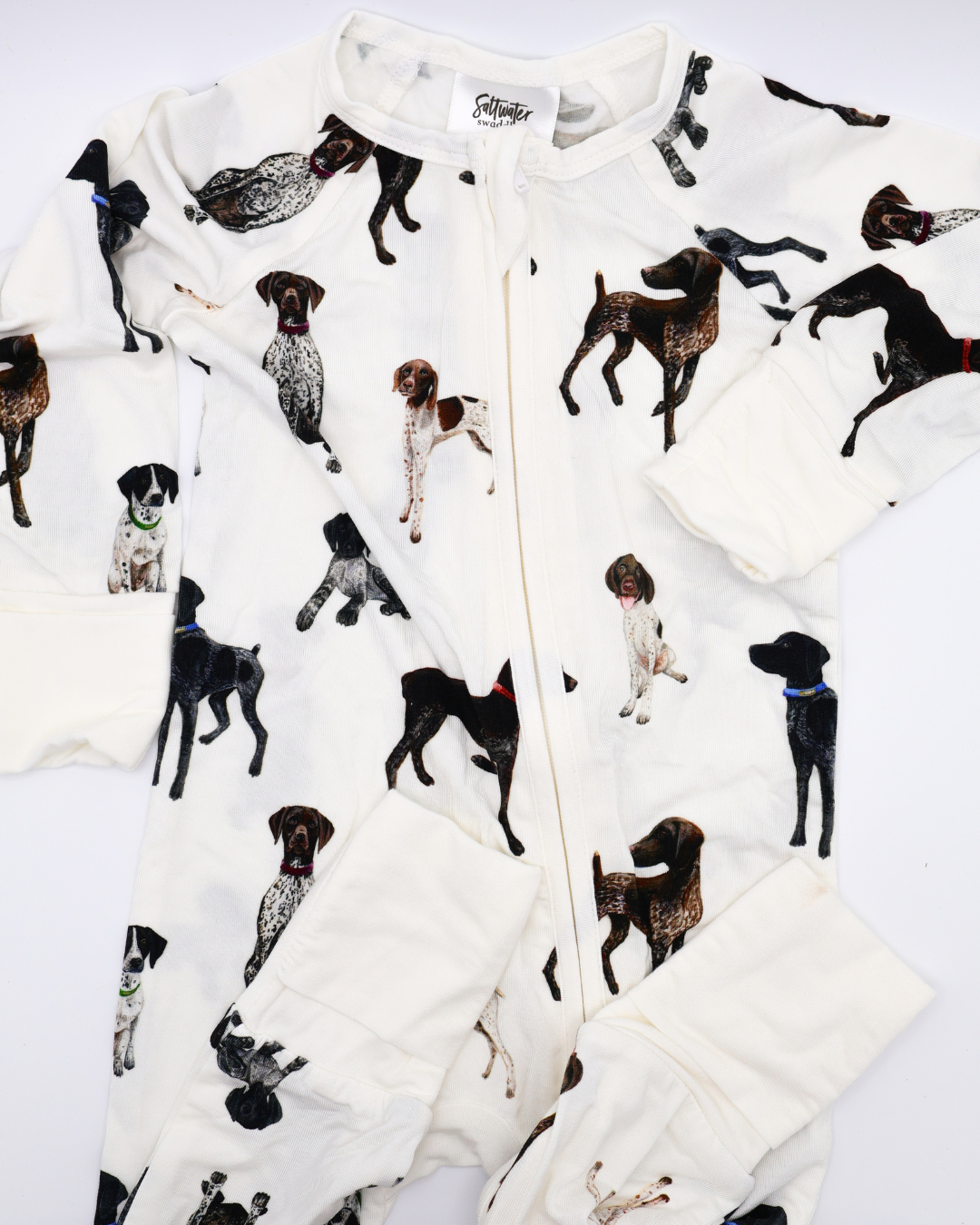 German Shorthaired Pointers pattern convertible zip footies, printed on soft white fabric. Shown displayed flat on a white background.