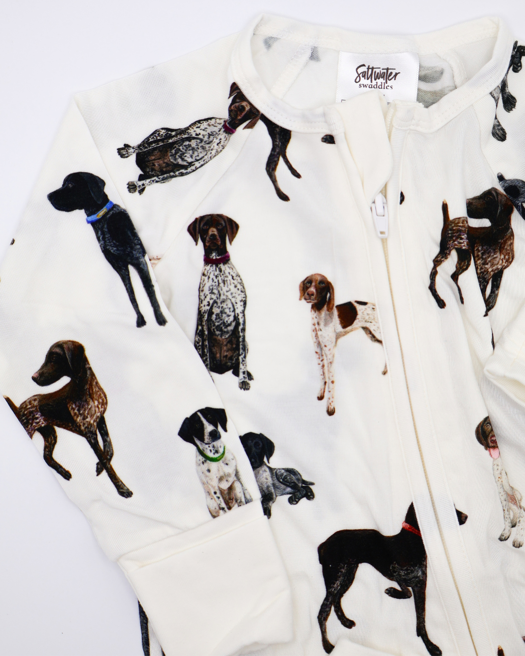 German Shorthaired Pointers pattern convertible zip footies, printed on soft white fabric. Shown displayed flat on a white background.