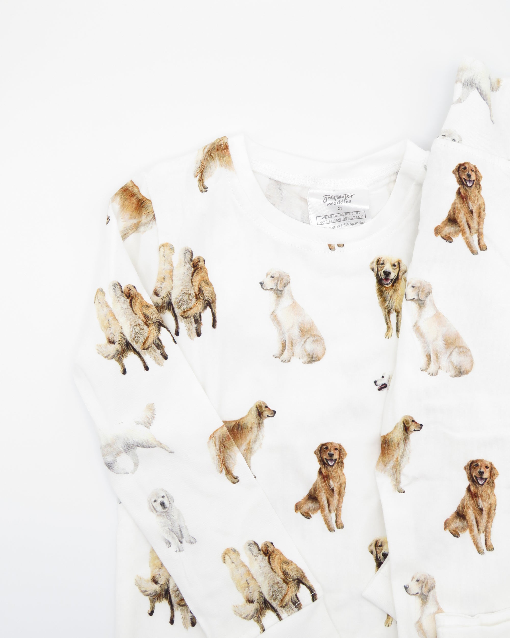 Golden Retriever dogs printed on kids pajamas in soft white cotton for sleepwear and loungewear, and with soft waistband and cuffs