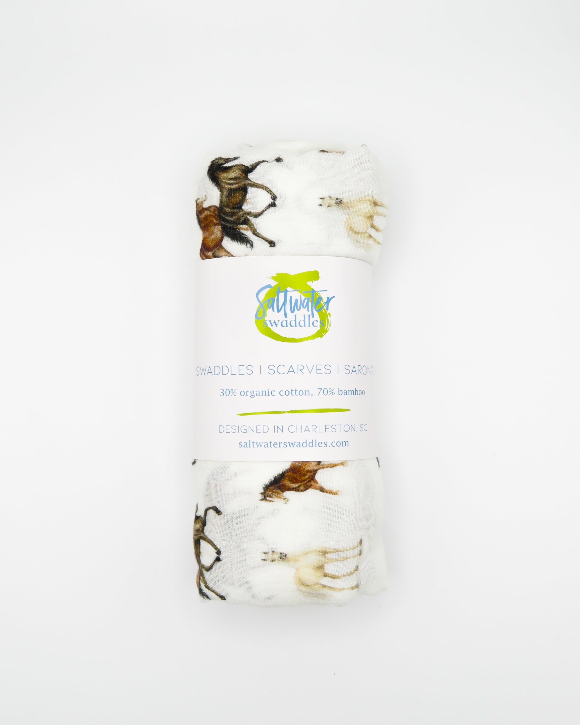 Harbor Horse swaddle with painted horse designs, made of soft white 30% organic cotton and 70% bamboo, perfect for wrapping a newborn and adding to a hospital bag.