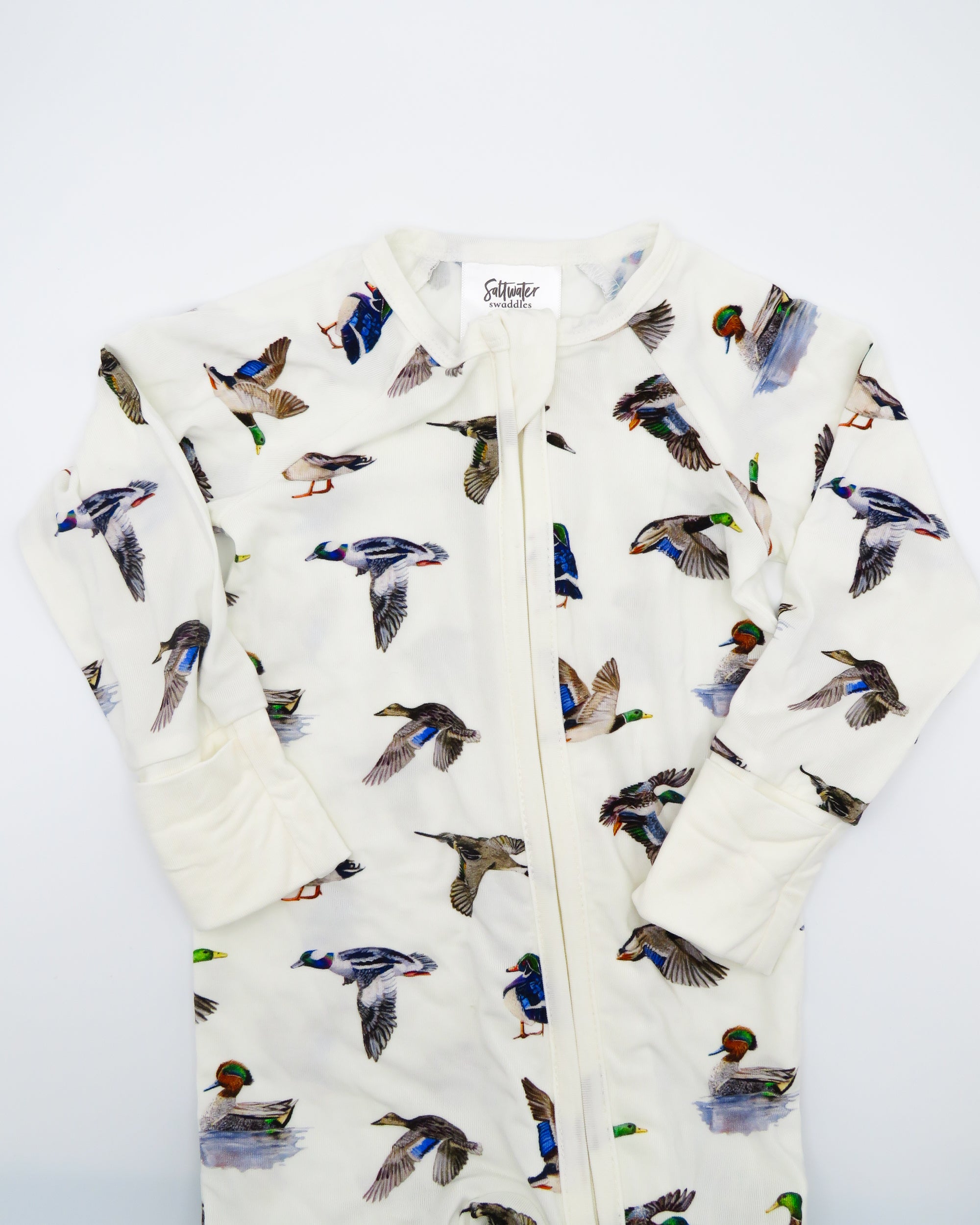 Unisex duck-print convertible zip footies for babies, designed for comfort and breathability.