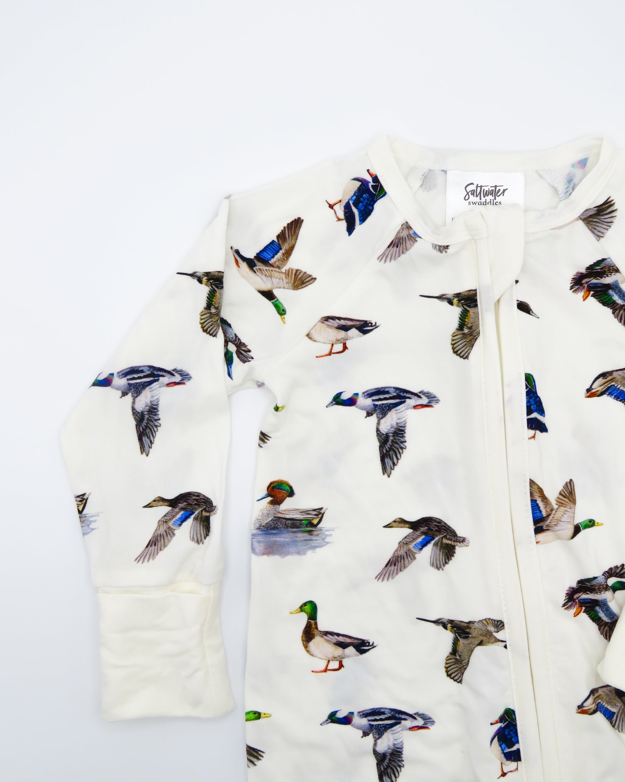 Unisex duck-print convertible zip footies for babies, designed for comfort and breathability.