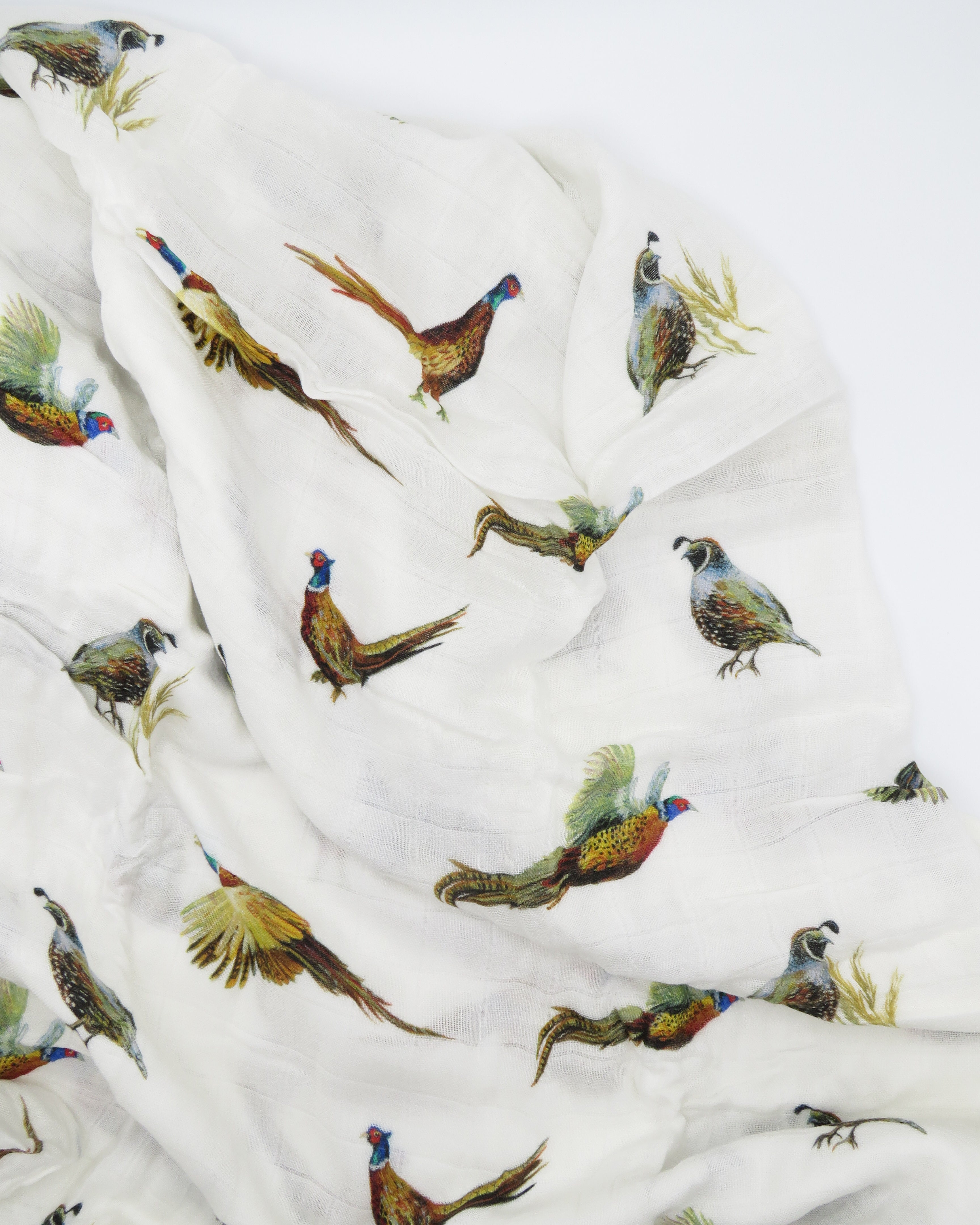Pheasant and Quail Print Baby Swaddle – Vibrant nature-inspired design made from organic white cotton and bamboo, cozy and soft, displayed flat on a white background.