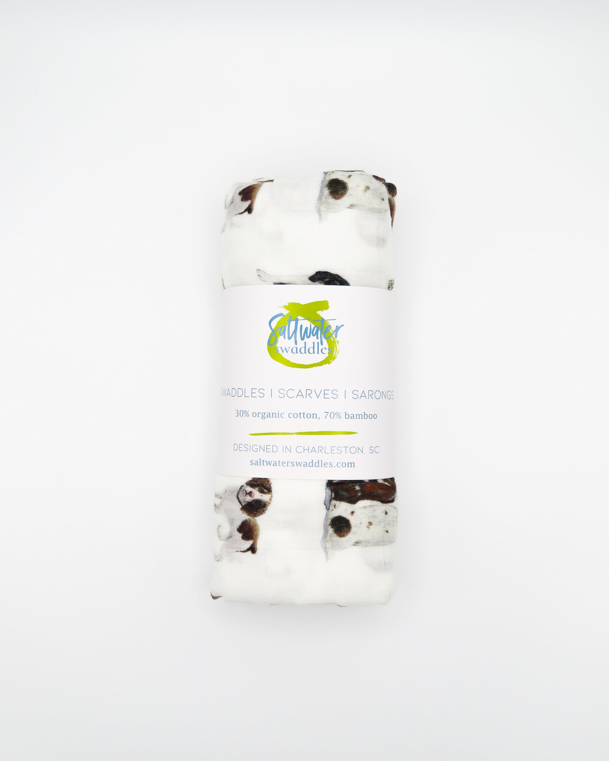 Springer Spaniel print baby swaddle blanket. Gender-neutral dog-themed swaddle for newborns. Springer Spaniel dogs printed on soft white fabric.