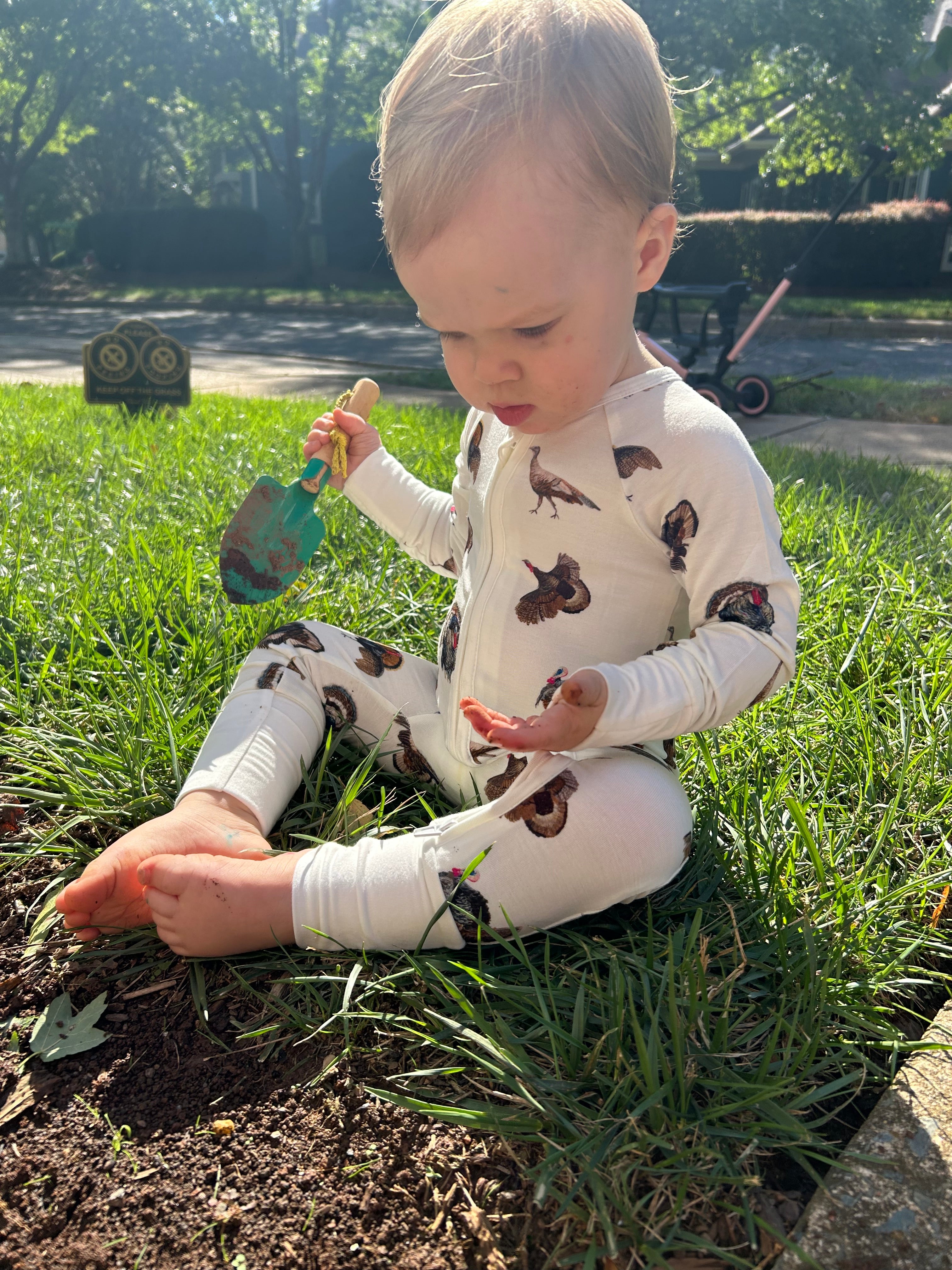 Convertible zip baby footie in festive turkey trot pattern for boys and girls.
