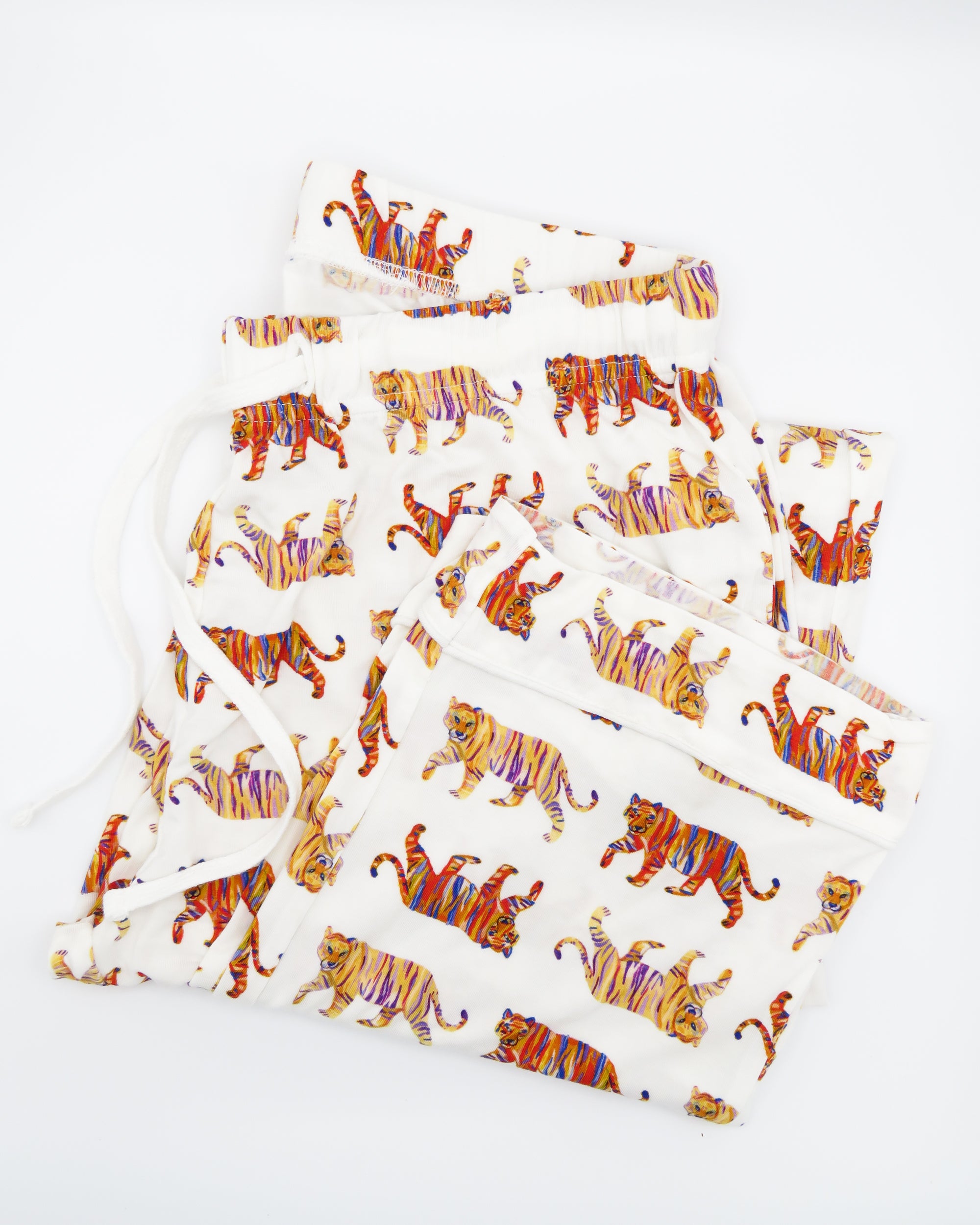Soft white unisex Easy Tiger print pajama pants.