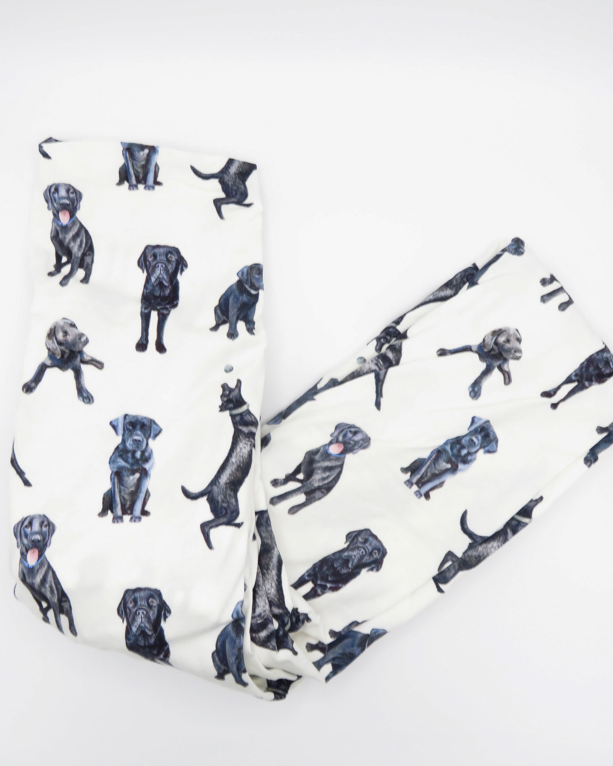 Fitted Black Lab crib sheet with adorable Labrador designs, crafted for durability and softness, perfect for both cribs and toddler beds.