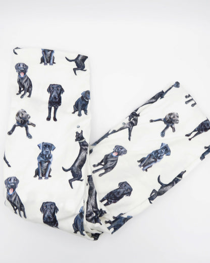 Fitted Black Lab crib sheet with adorable Labrador designs, crafted for durability and softness, perfect for both cribs and toddler beds.