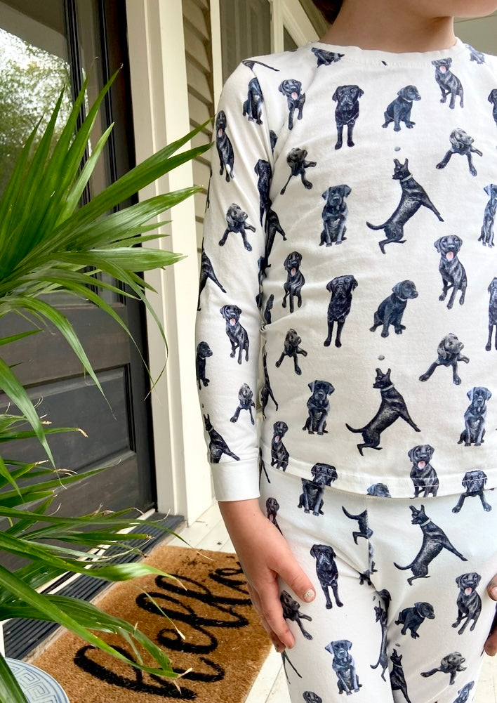 Soft and stretchy kids pajamas adorned with a cute Black Labs print, designed for comfort and durability, making them a favorite choice for little dog lovers