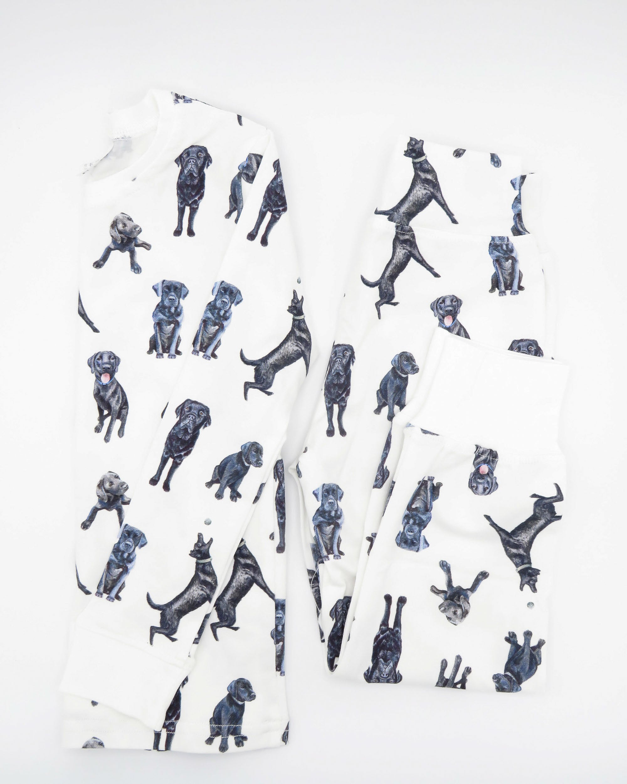 Soft and stretchy kids pajamas adorned with a cute Black Labs print, designed for comfort and durability, making them a favorite choice for little dog lovers