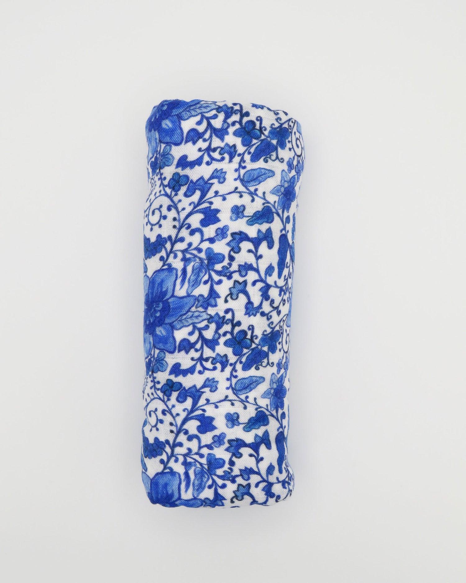 Charming newborn gown and matching hat featuring a timeless Chinoiserie print on soft white fabric, perfect for special newborn moments.