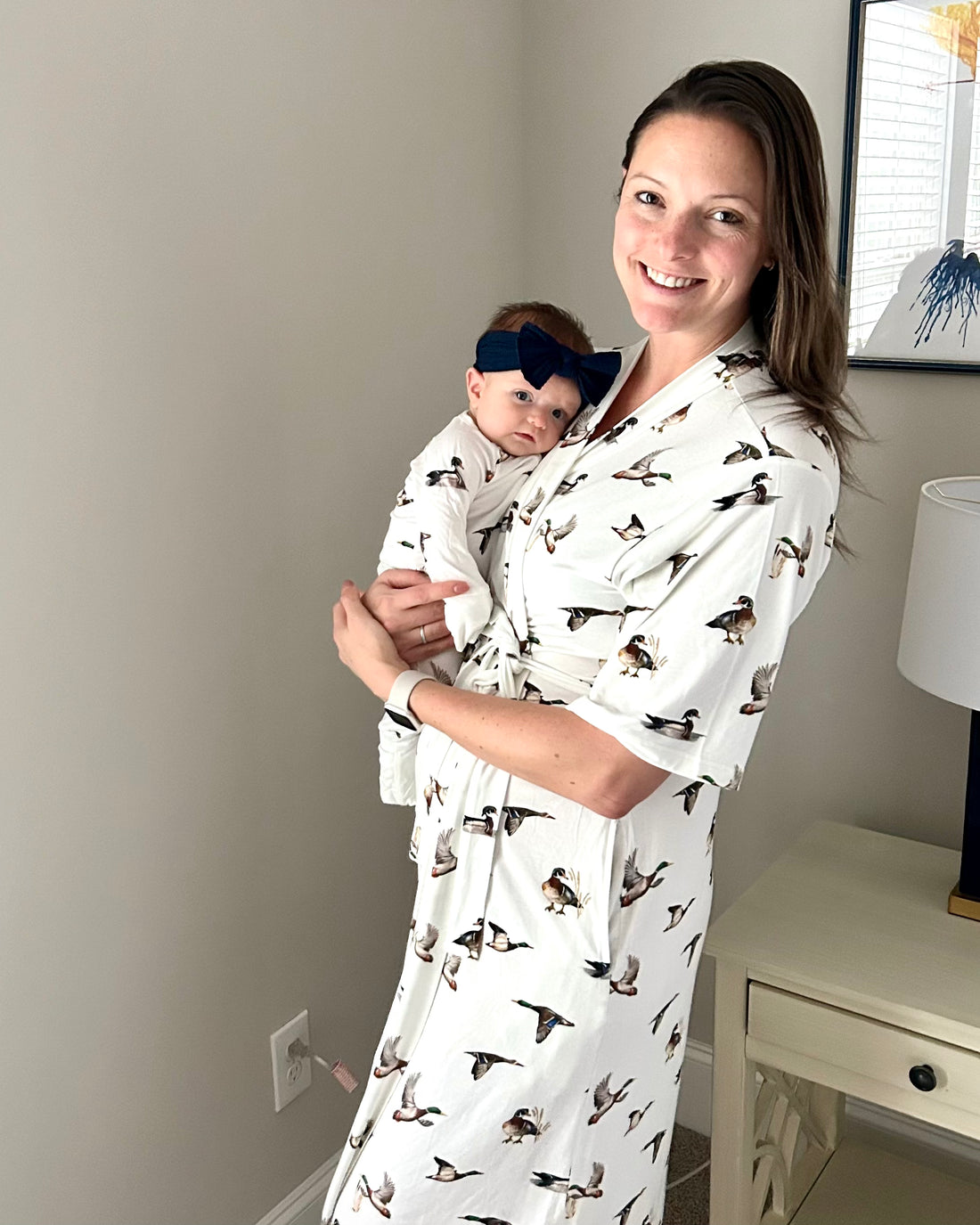 Adult loungewear robe with playful diving ducks print, made from soft and cozy fabric.