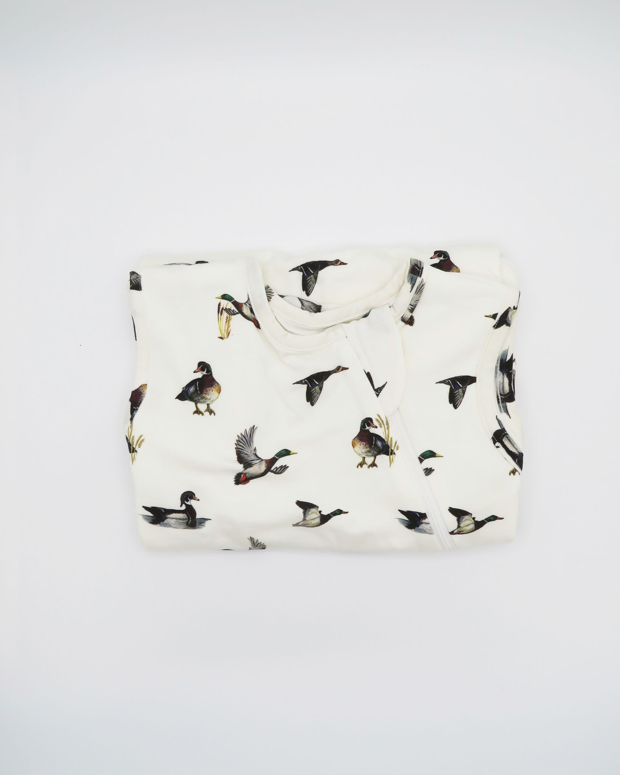 Baby white sleep sack featuring a charming diving ducks print, perfect for cozy nighttime snuggles.