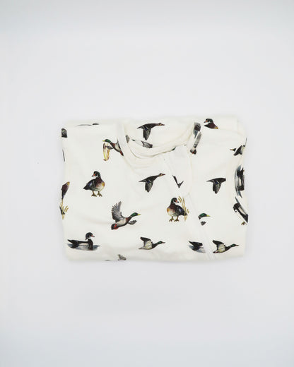 Baby white sleep sack featuring a charming diving ducks print, perfect for cozy nighttime snuggles.