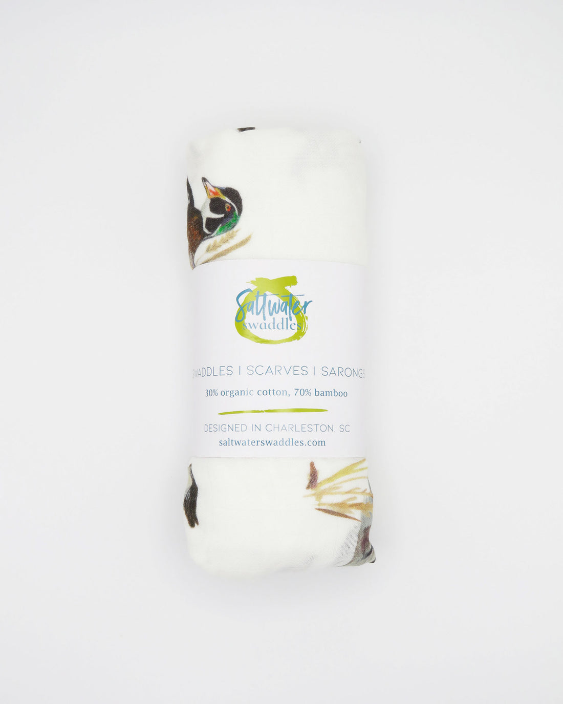 Vibrant watercolor diving ducks pattern swaddle, perfect for wrapping newborns in style and comfort. The soft white fabric features an adorable diving ducks print. Your baby will look precious wrapped in this cute swaddle, ideal for those first special moments and a thoughtful addition to the hospital bag.