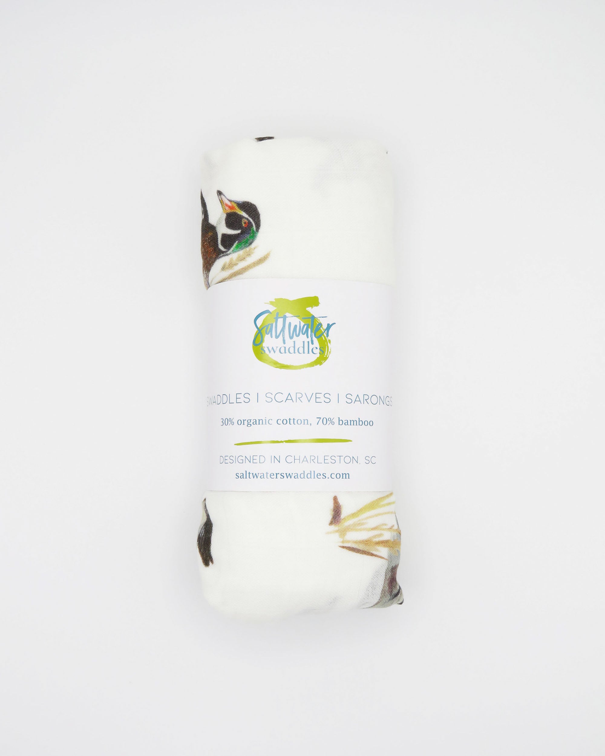 Vibrant watercolor diving ducks pattern swaddle, perfect for wrapping newborns in style and comfort. The soft white fabric features an adorable diving ducks print. Your baby will look precious wrapped in this cute swaddle, ideal for those first special moments and a thoughtful addition to the hospital bag.