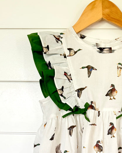 Close up of Diving Ducks flutter dress printed on soft white fabric. Perfect for indoors and outdoors.