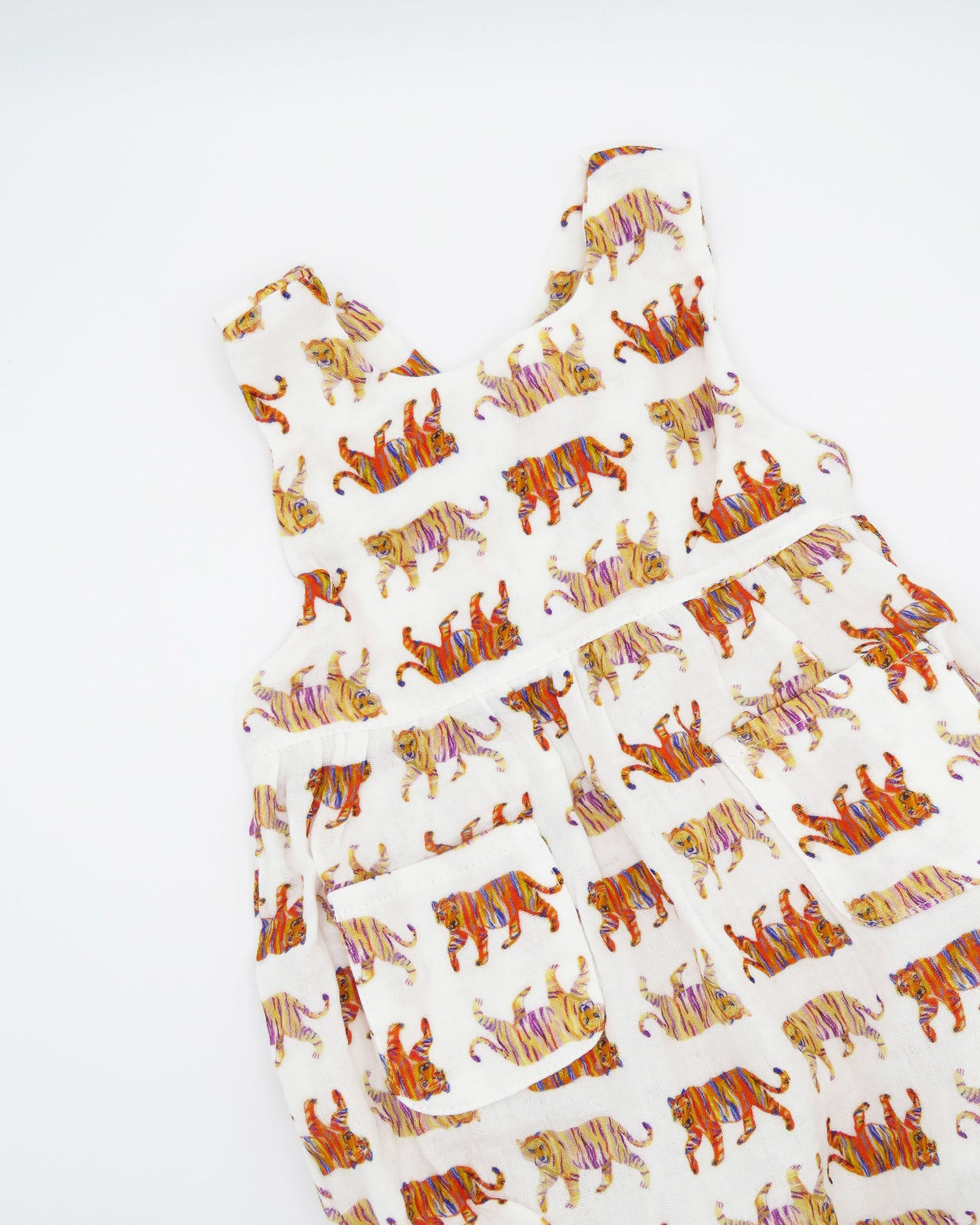 Easy Tiger print Comfy Organic Cotton Sunsuit for Children with Snaps for Easy Diaper Changes. Printed on a soft white fabric.