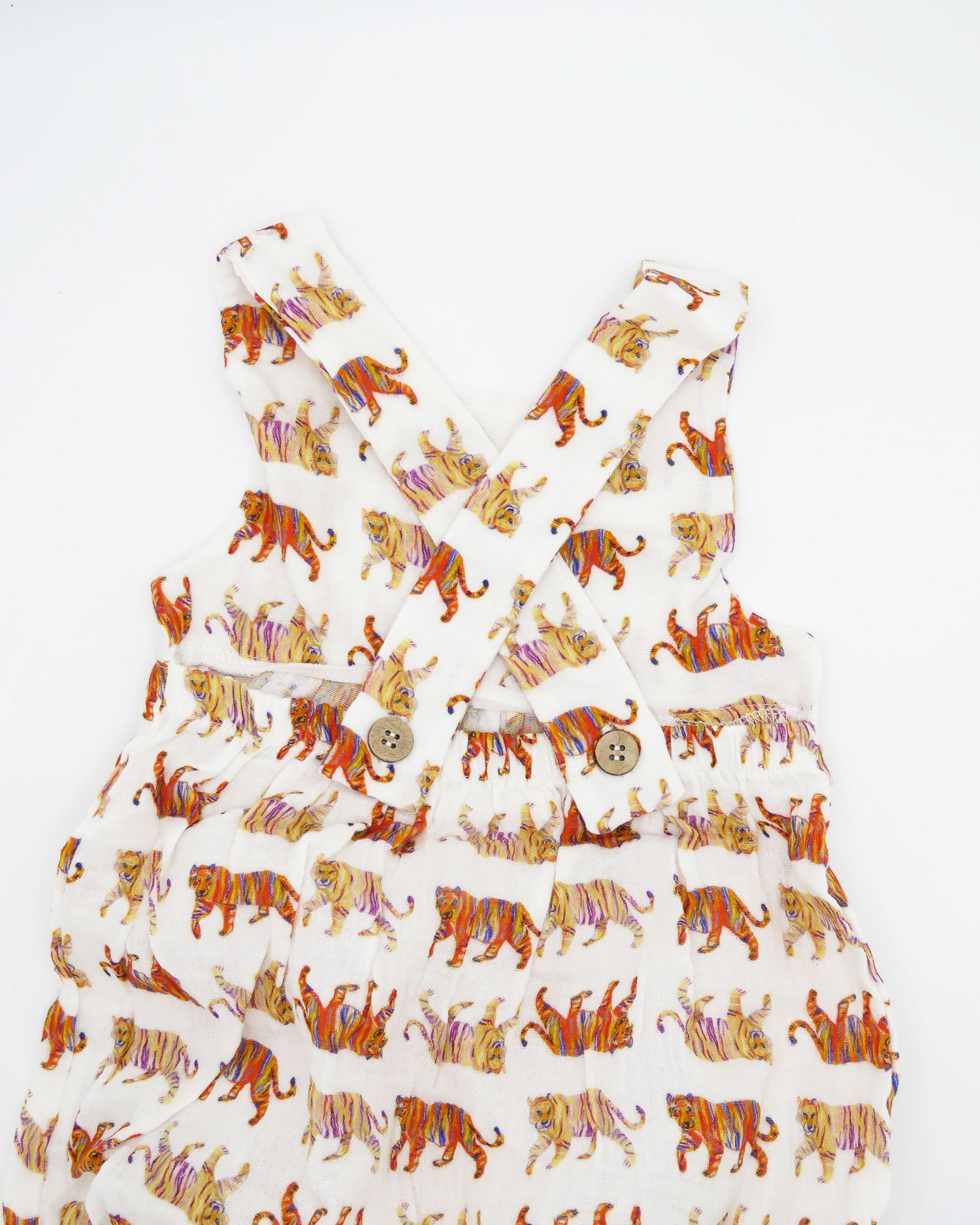 Easy Tiger print Comfy Organic Cotton Sunsuit for Children with Snaps for Easy Diaper Changes. Printed on a soft white fabric.