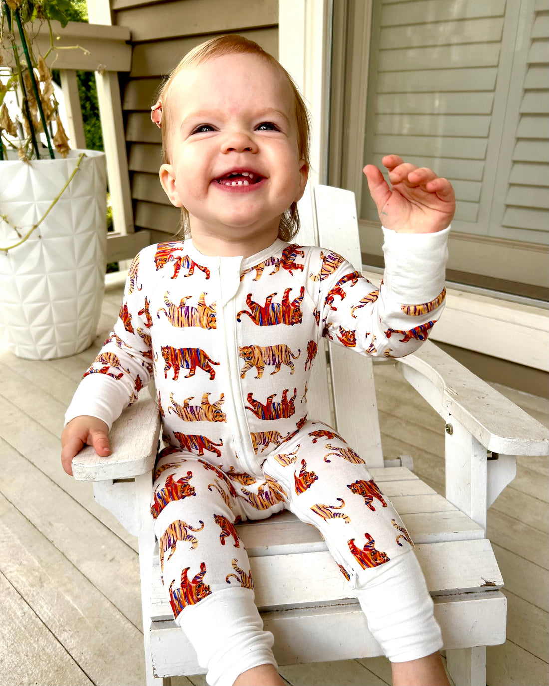 Convertible zip footie for kids with playful tiger pattern, made from gentle fabric