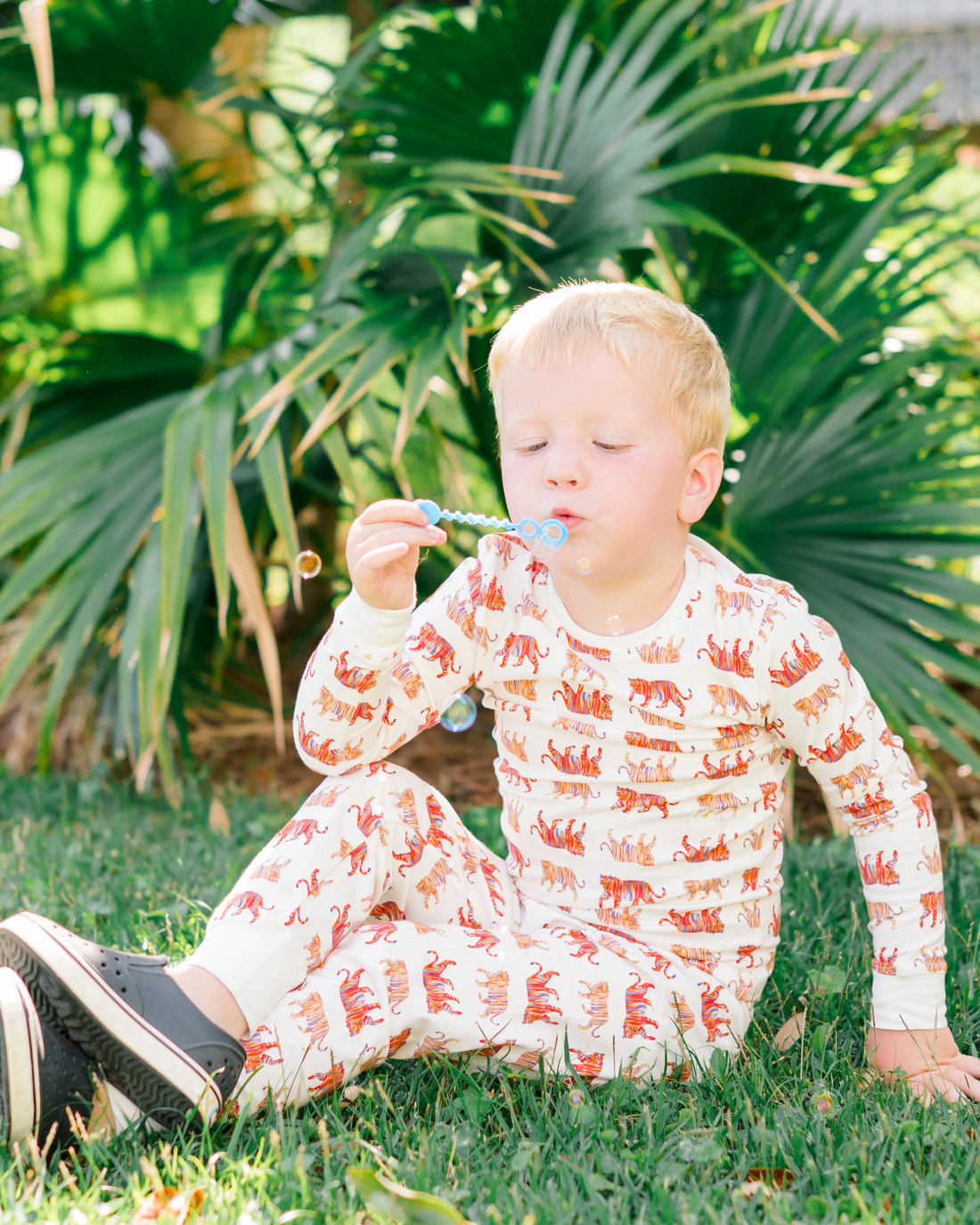 Convertible zip footie for kids with playful tiger pattern, made from gentle fabric