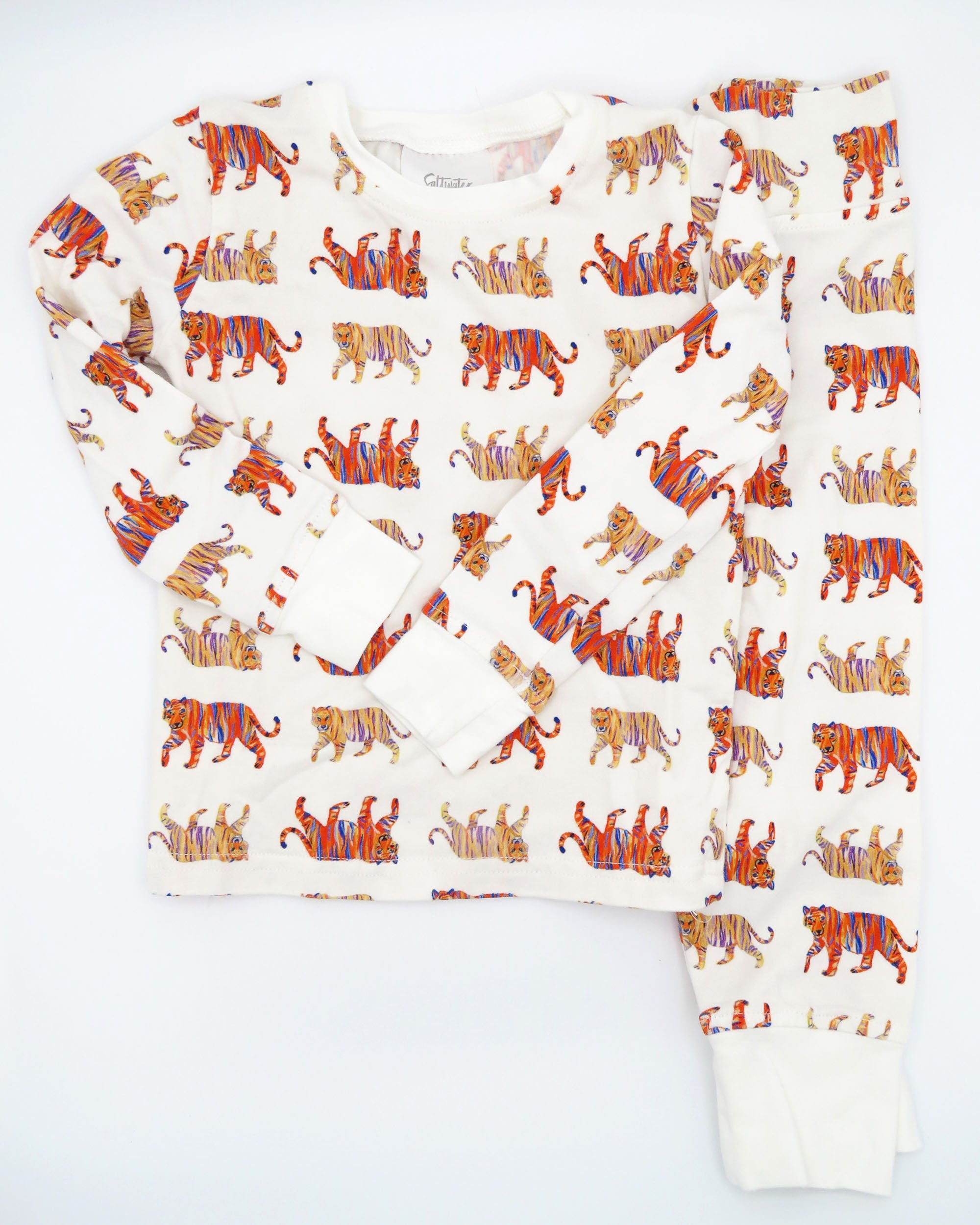 Easy Tiger kids pajamas printed on soft white fabric. Breathable and comfortable sleepwear and loungewear, perfect for indoor playtime or outdoor fun.