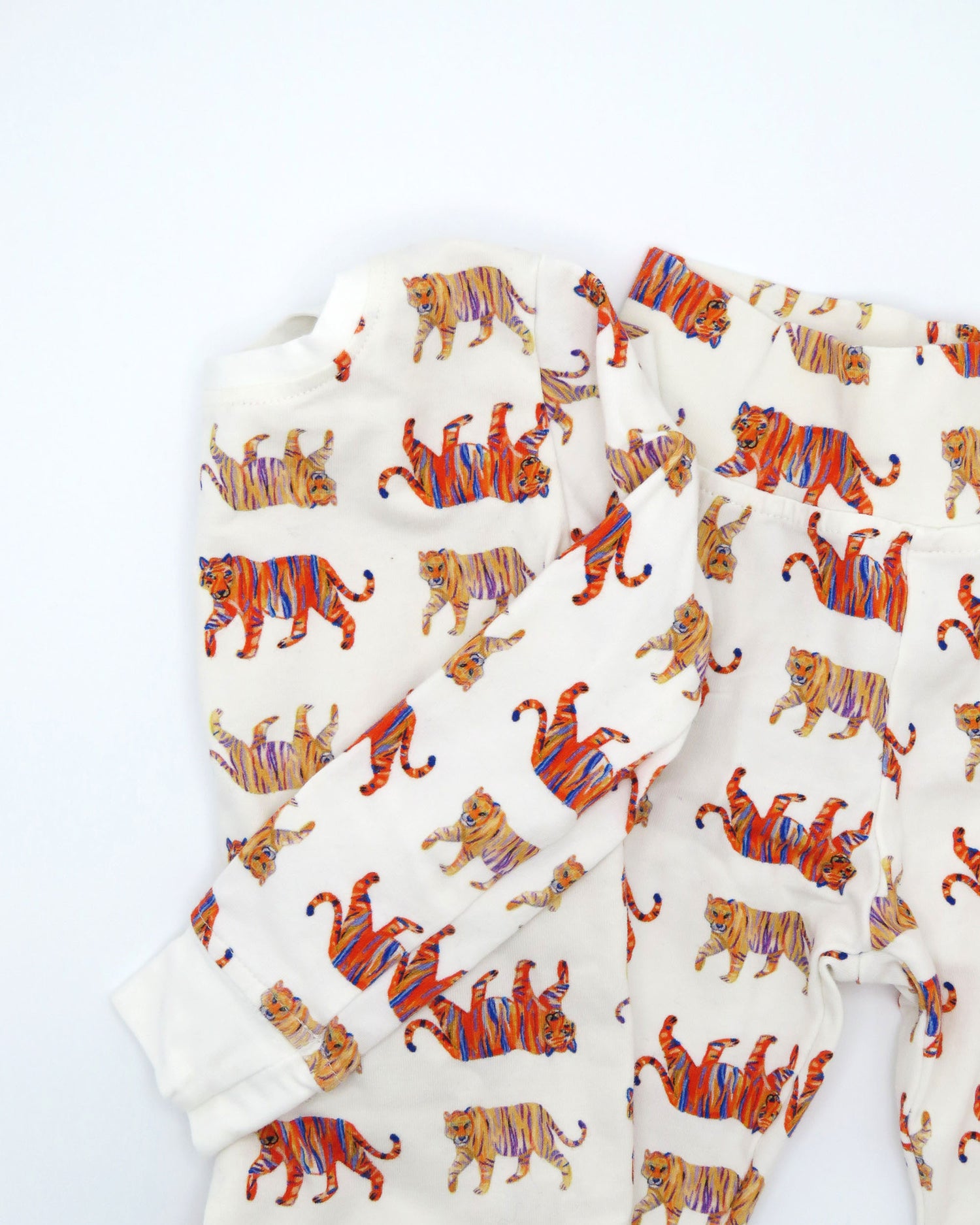 Easy Tiger kids pajamas printed on soft white fabric. Breathable and comfortable sleepwear and loungewear, perfect for indoor playtime or outdoor fun.