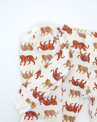 Easy Tiger kids pajamas printed on soft white fabric. Breathable and comfortable sleepwear and loungewear, perfect for indoor playtime or outdoor fun.