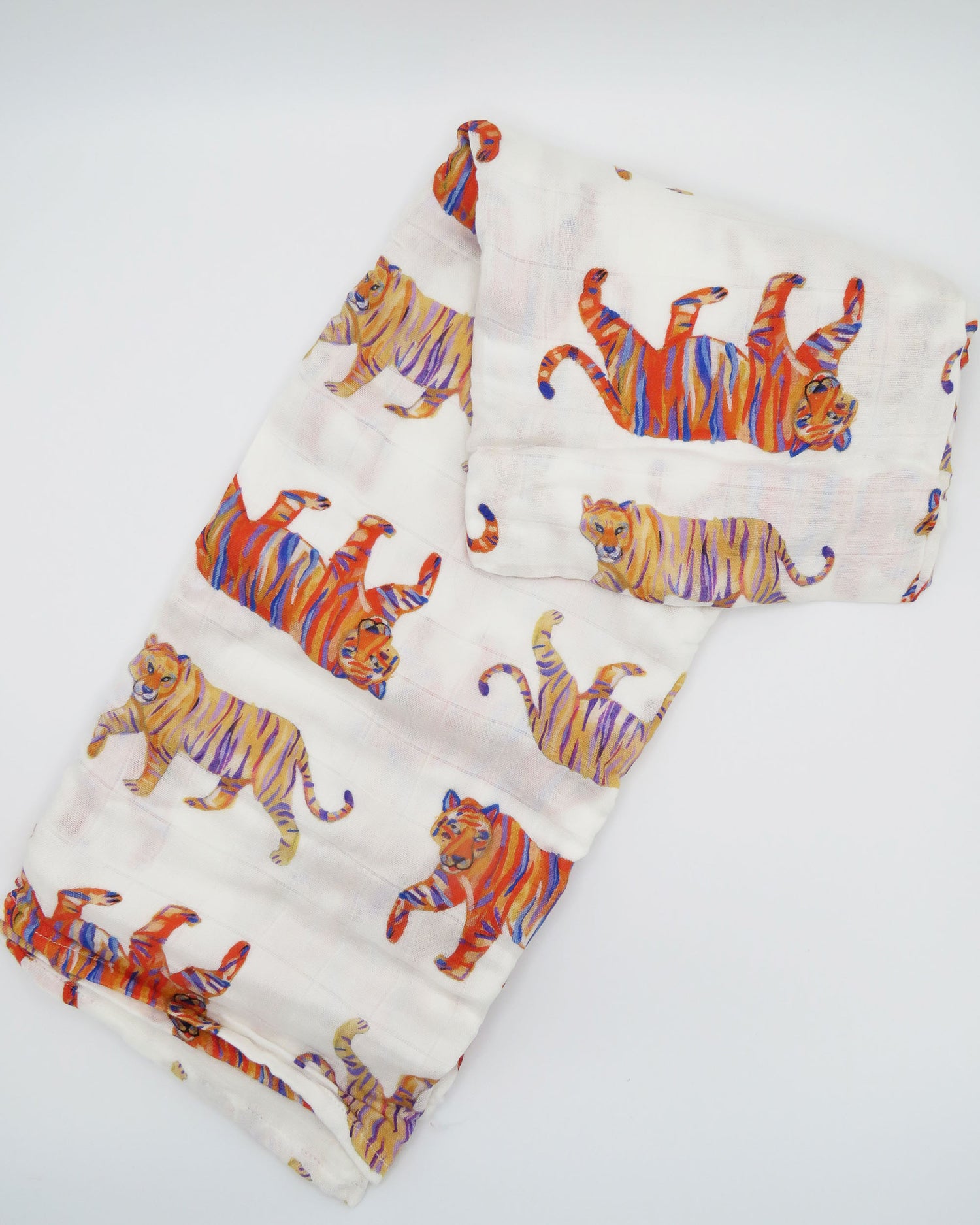 Soft and comfy Easy Tiger swaddle made from organic white cotton and bamboo, perfect for keeping a newborn cozy and comfortable during sleep or nap time.