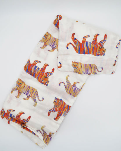Soft and comfy Easy Tiger swaddle made from organic white cotton and bamboo, perfect for keeping a newborn cozy and comfortable during sleep or nap time.