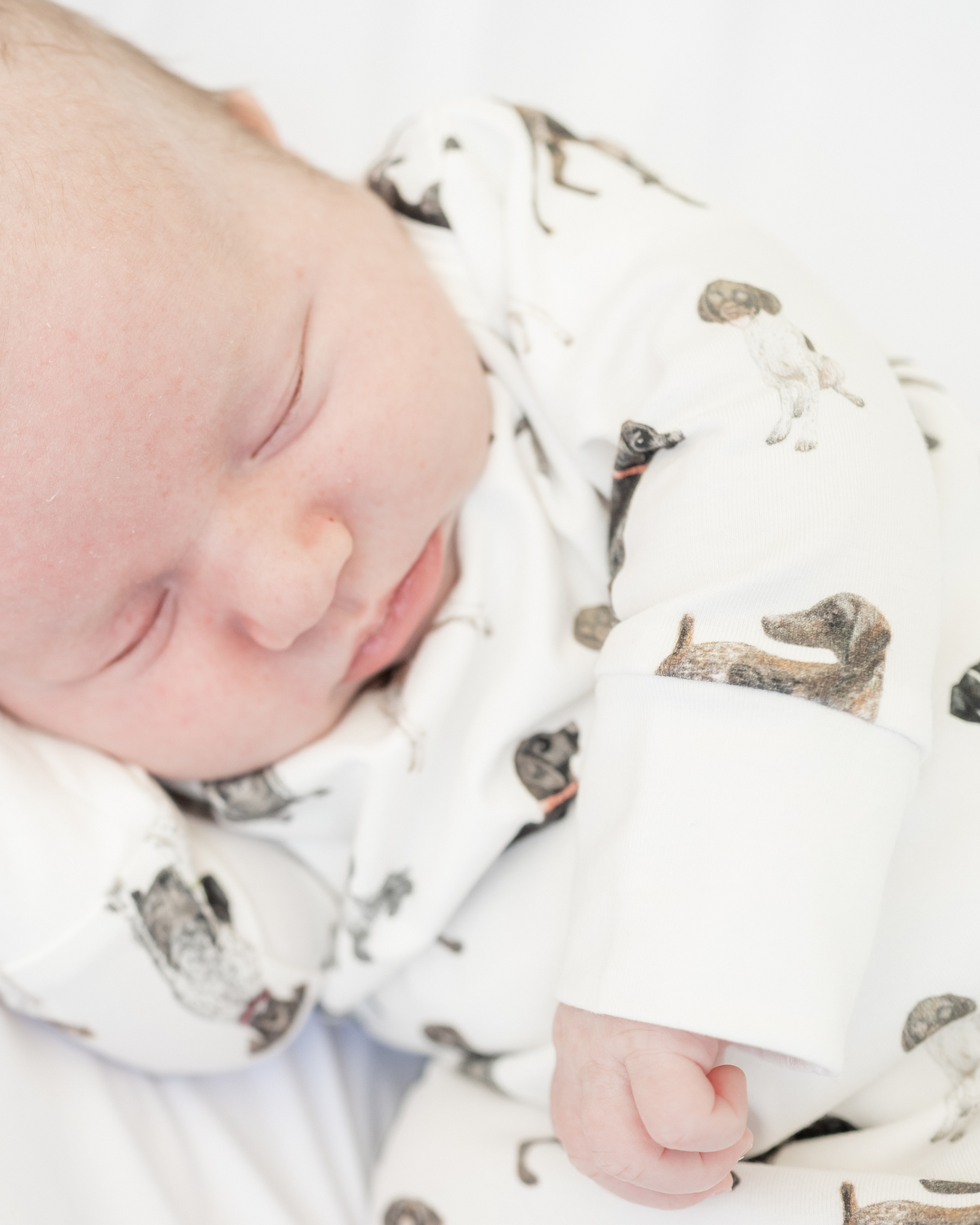 Cozy and soft Newborn gown + hat featuring German Shorthaired Pointer printed on soft white fabric, perfect addition to your hospital bag.