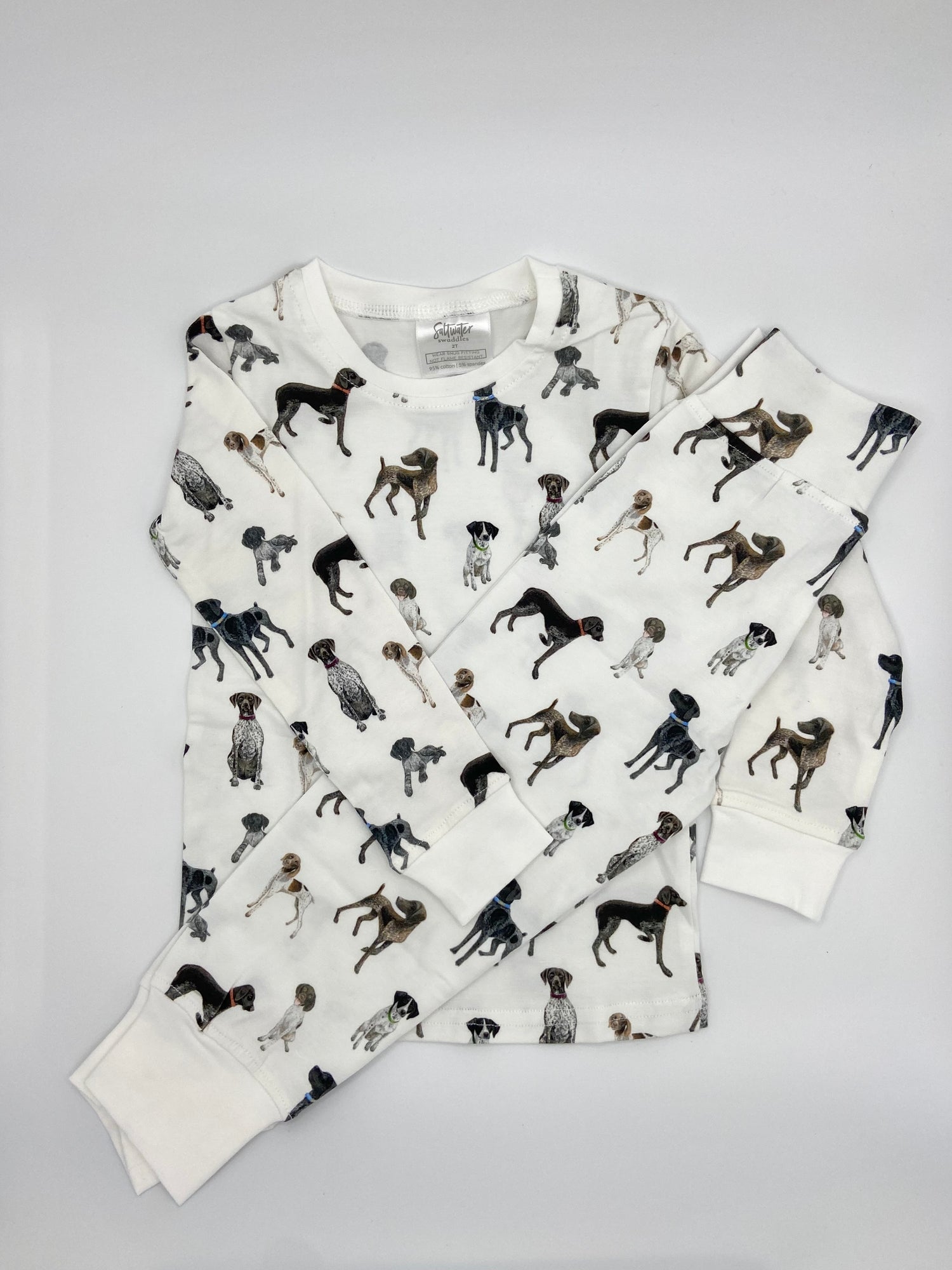 Children wearing comfy kids pajamas with German Shorthaired Pointer printed on soft white fabric