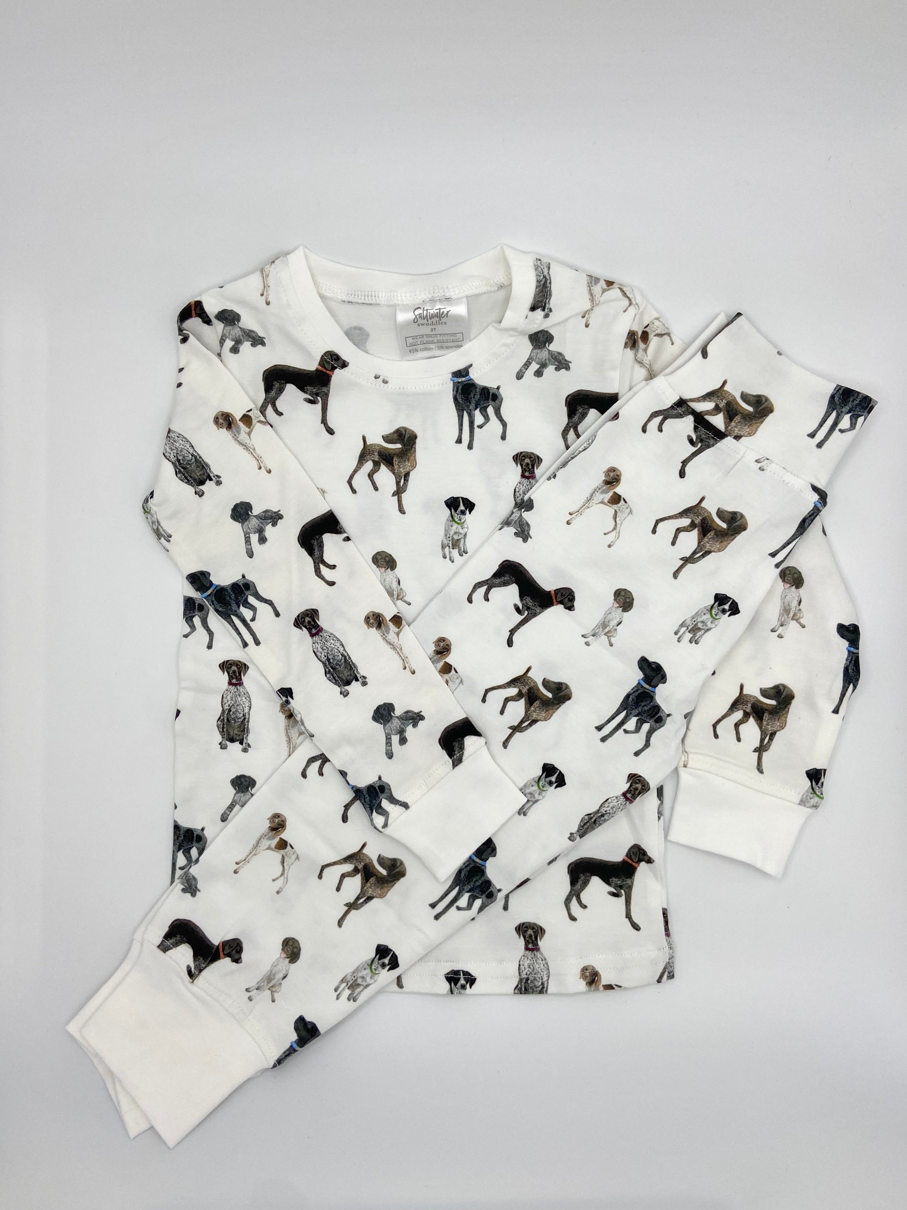 Children wearing comfy kids pajamas with German Shorthaired Pointer printed on soft white fabric
