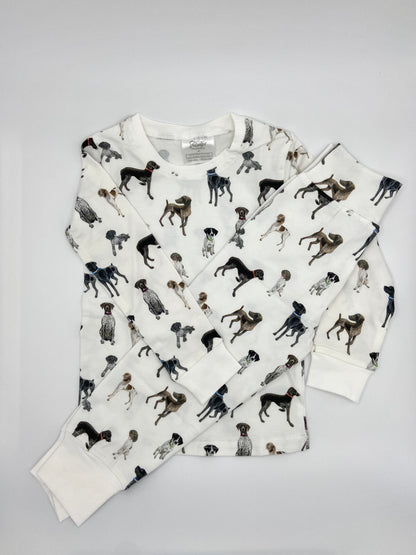 Children wearing comfy kids pajamas with German Shorthaired Pointer printed on soft white fabric