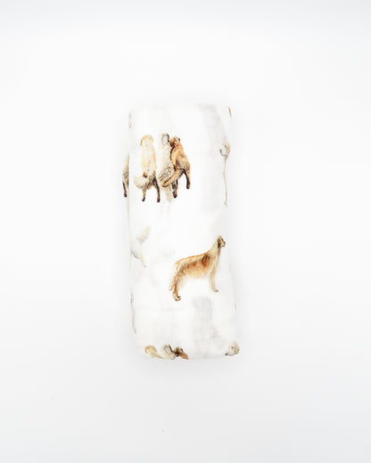 Golden Retriever print baby swaddle in organic cotton and bamboo blend. Golden Retrievers printed on soft white fabric.