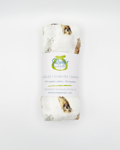 Golden Retriever print baby swaddle in soft white organic cotton and bamboo blend. A perfect for golden fans.