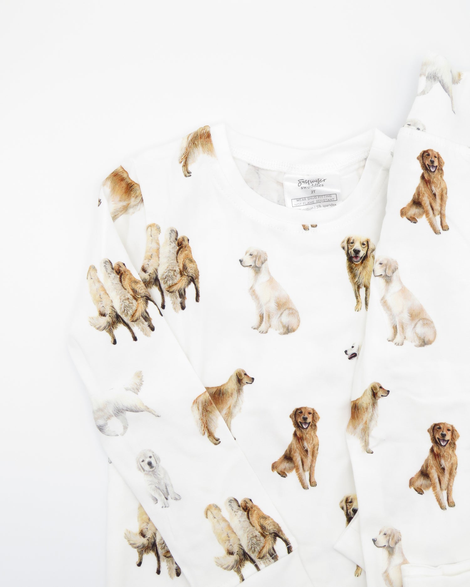 Golden Retriever dogs printed on kids pajamas in soft white cotton for sleepwear and loungewear, and with soft waistband and cuffs