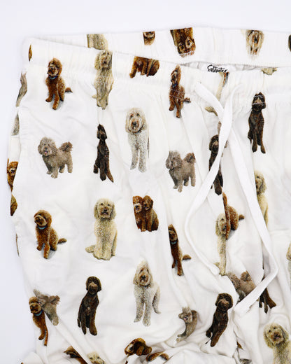 Soft white adult pajama pants featuring an all-over realistic goldendoodle pattern with an elastic waistband and white drawstring tie.