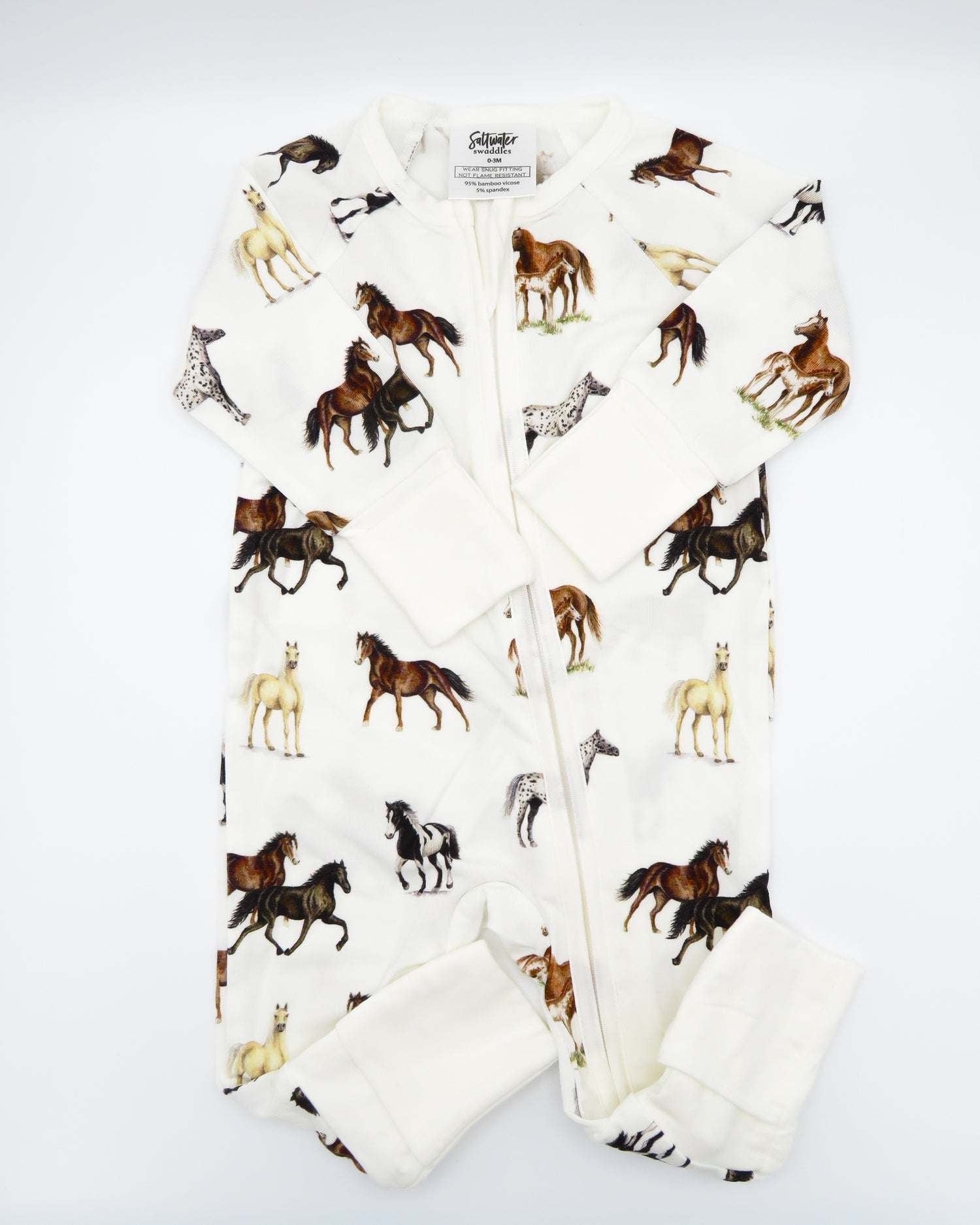 Harbor Horses convertible baby zip footie pajamas with hand-painted horse designs in vibrant colors on white 100% bamboo fabric, featuring fold-over feet for comfort and convertible wear. A perfect addition to your baby essentials.