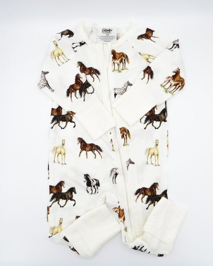Harbor Horses convertible baby zip footie pajamas with hand-painted horse designs in vibrant colors on white 100% bamboo fabric, featuring fold-over feet for comfort and convertible wear. A perfect addition to your baby essentials.