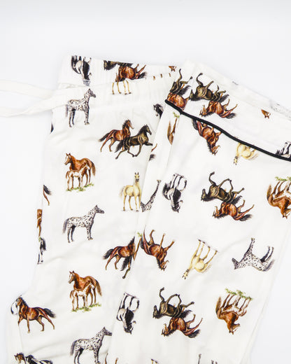 Adult unisex pajama pants with favorite harbor horse print, made of soft white bamboo-spandex blend, featuring elastic waistband with drawstring, pockets, and piping on hems, perfect for lounging or bedtime.