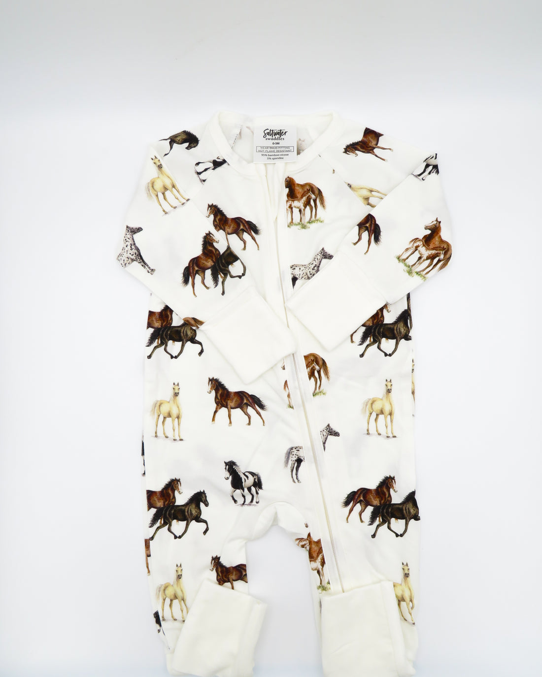 Harbor Horses convertible baby zip footie pajamas with hand-painted horse designs in vibrant colors on white 100% bamboo fabric, featuring fold-over feet for comfort and convertible wear. A perfect addition to your baby essentials.