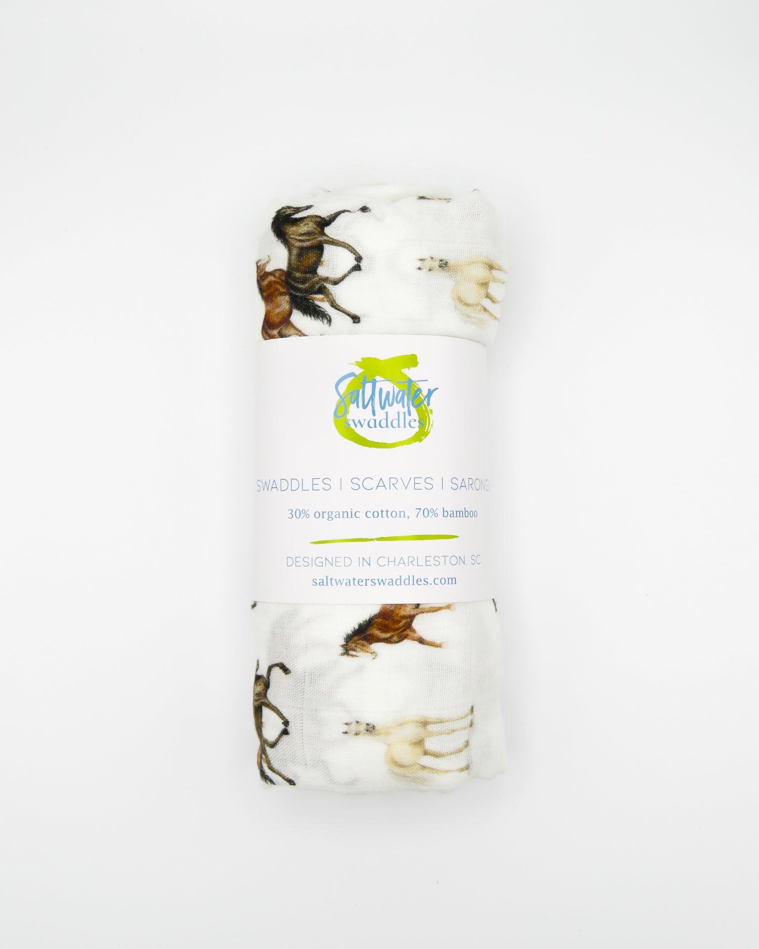 Harbor Horse swaddle with painted horse designs, made of soft white 30% organic cotton and 70% bamboo, perfect for wrapping a newborn and adding to a hospital bag.