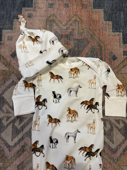Harbor Horses Newborn Gown and Hat set printed on soft white fabric, featuring a charming harbor horses pattern. This cozy newborn outfit includes a matching hat and gown, making it a newborn’s new favorite and a perfect addition to your hospital bag.
