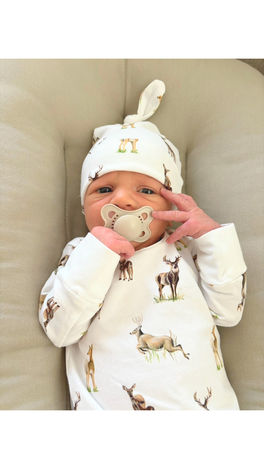 Newborn hat featuring a whimsical little fawn and big yawn deer print on soft fabric